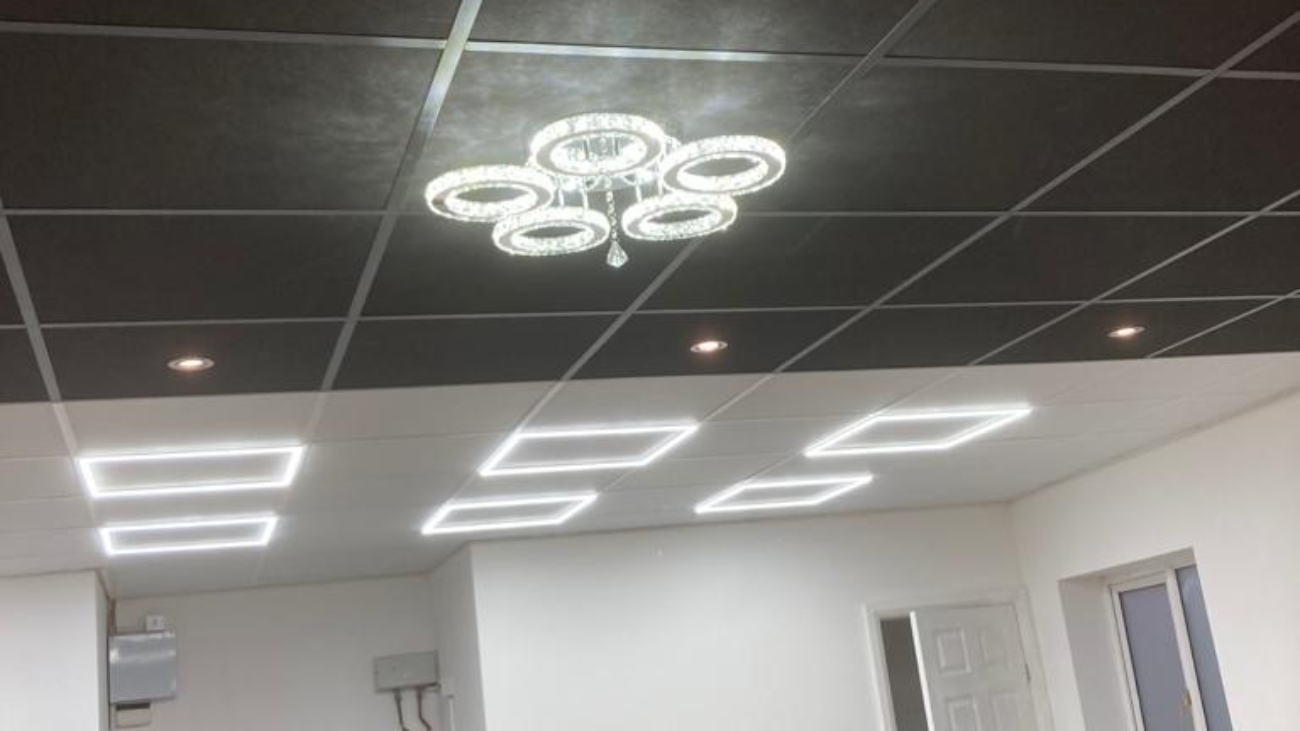 Suspended ceiling with black and white ceiling tiles