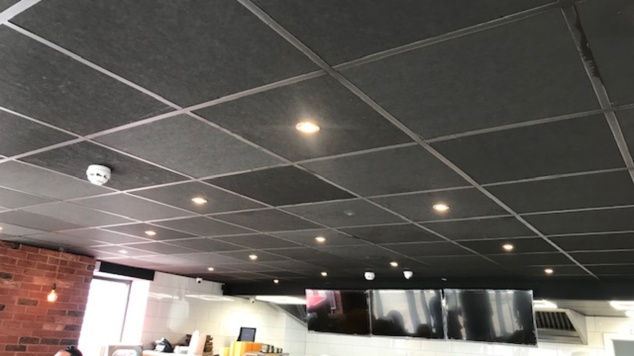 Suspended ceiling with black ceiling tiles